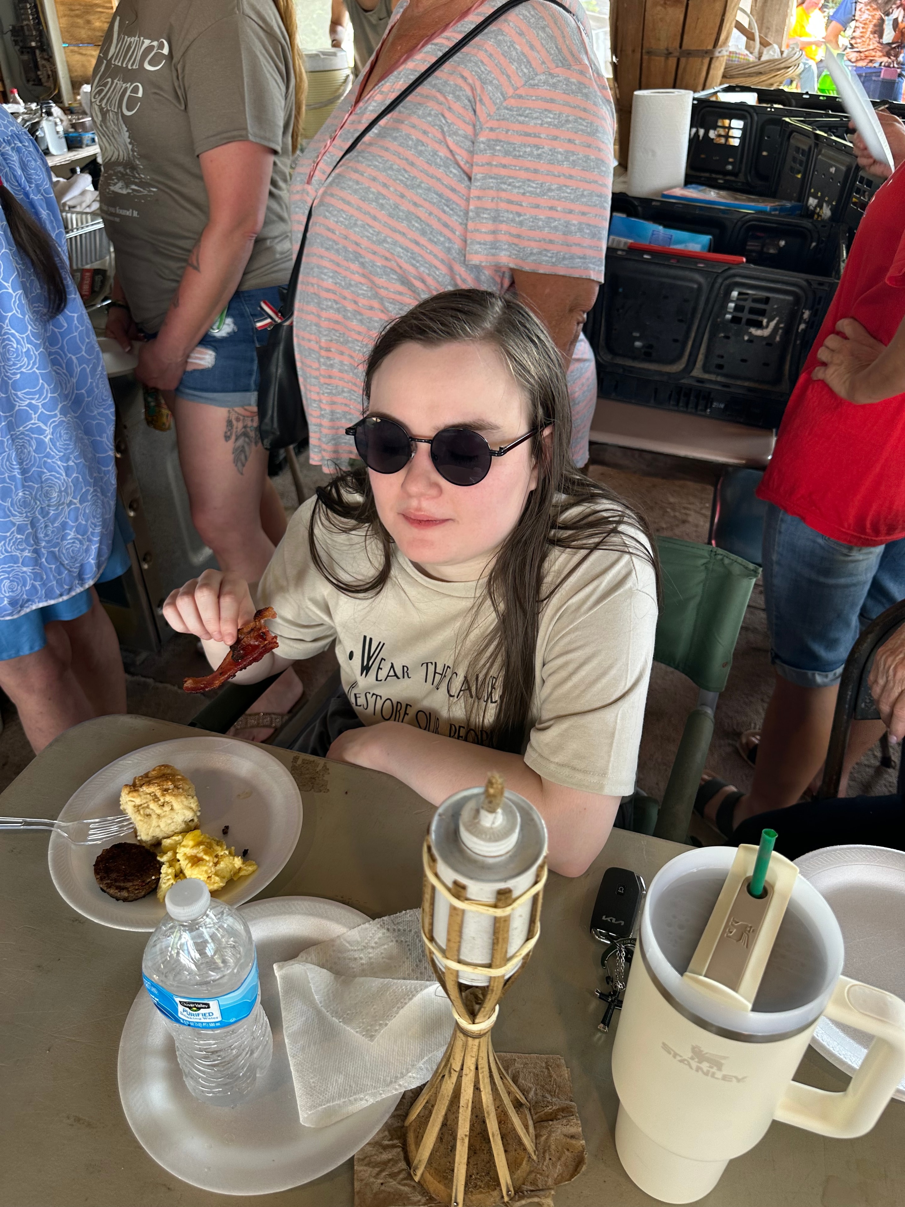 Tribal member wearing Wear the Cause shirt enjoying the feast at Green Tree Ceremony July 11, 2026