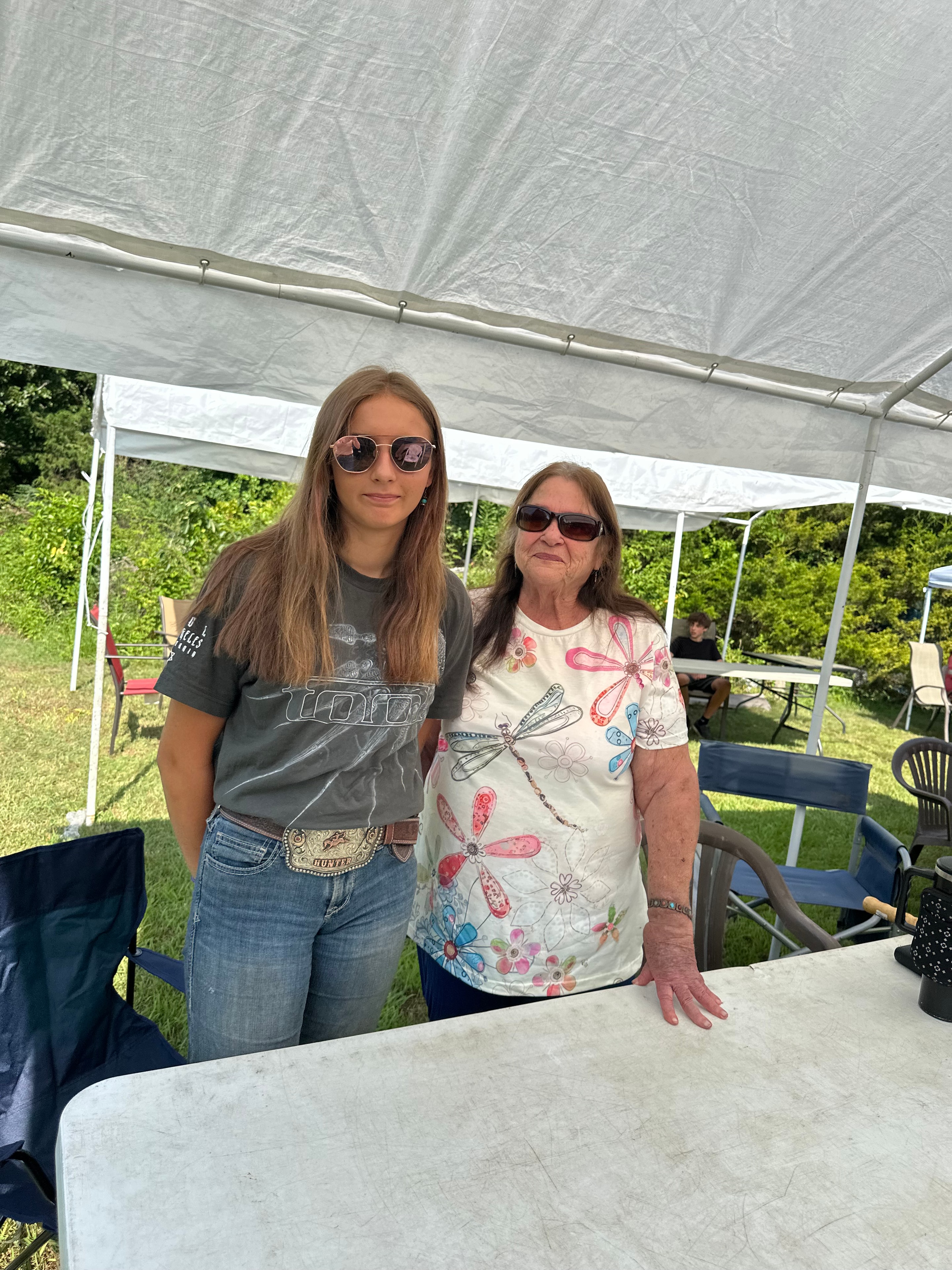 Two tribal members under the tent at Green Tree Ceremony July 11, 2026