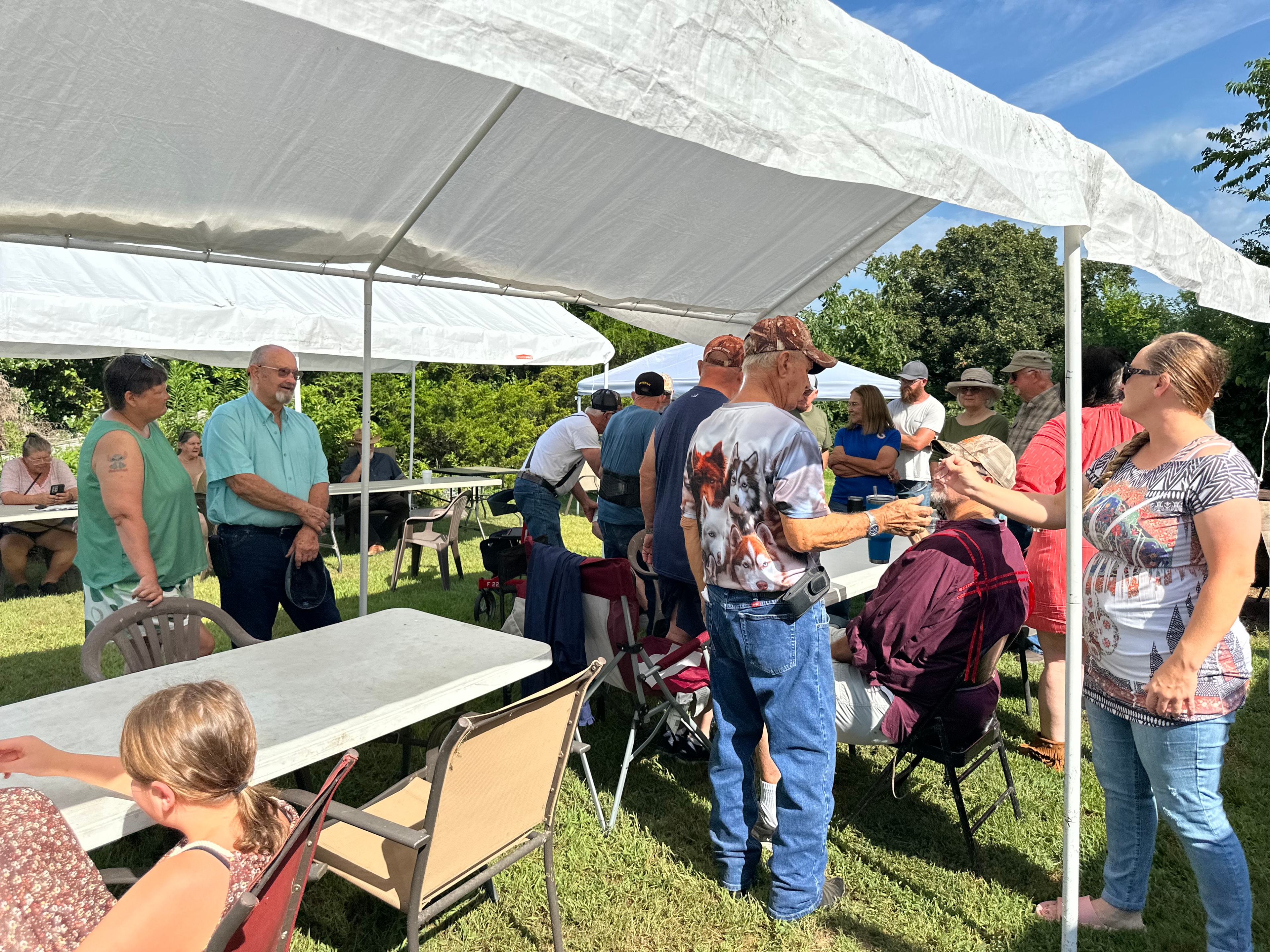 Large group of tribal members gathered under the tent at Green Tree Ceremony July 11, 2026