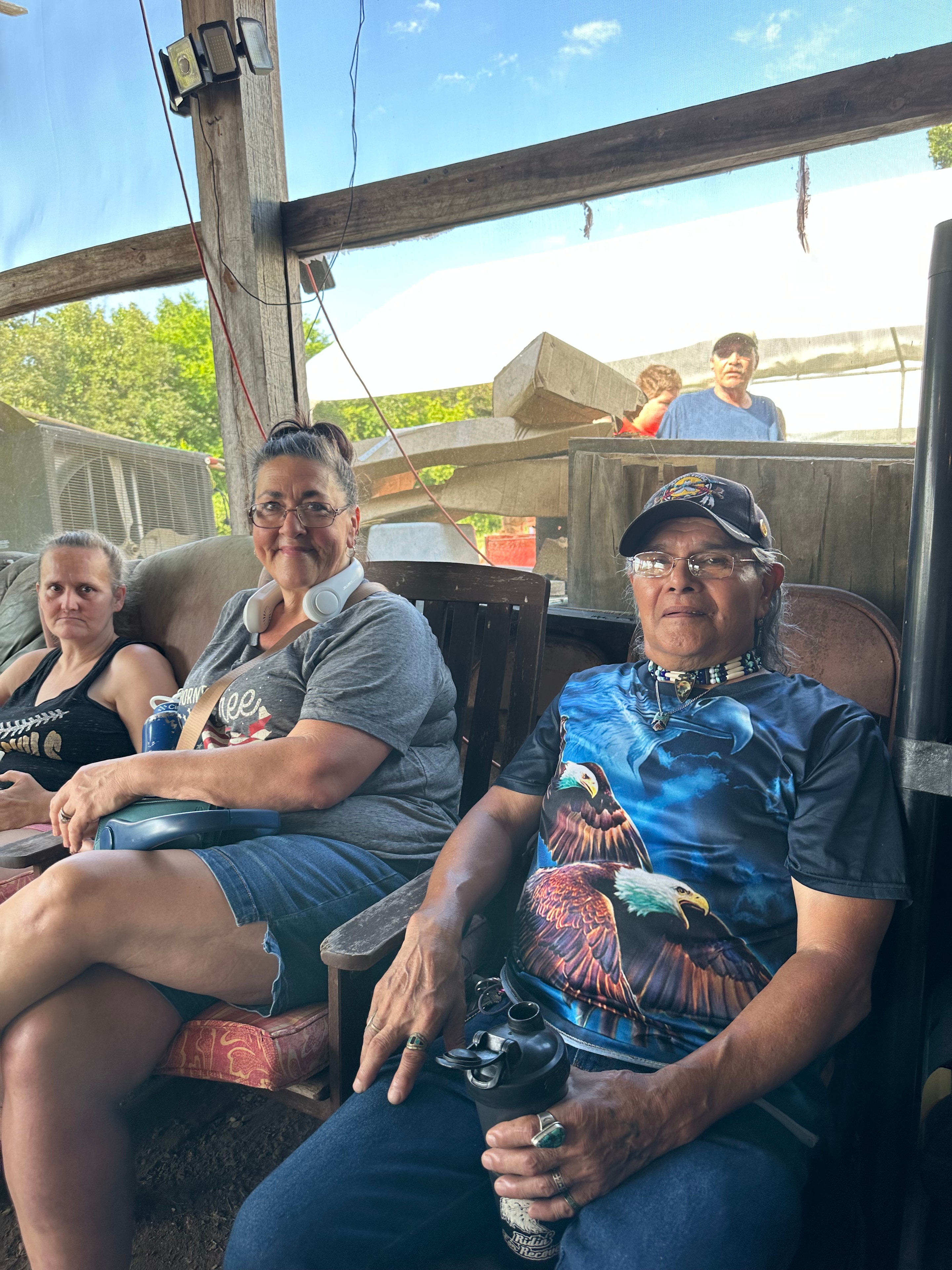 Tribal members seated at the ceremonial grounds at Green Tree Ceremony July 11, 2026