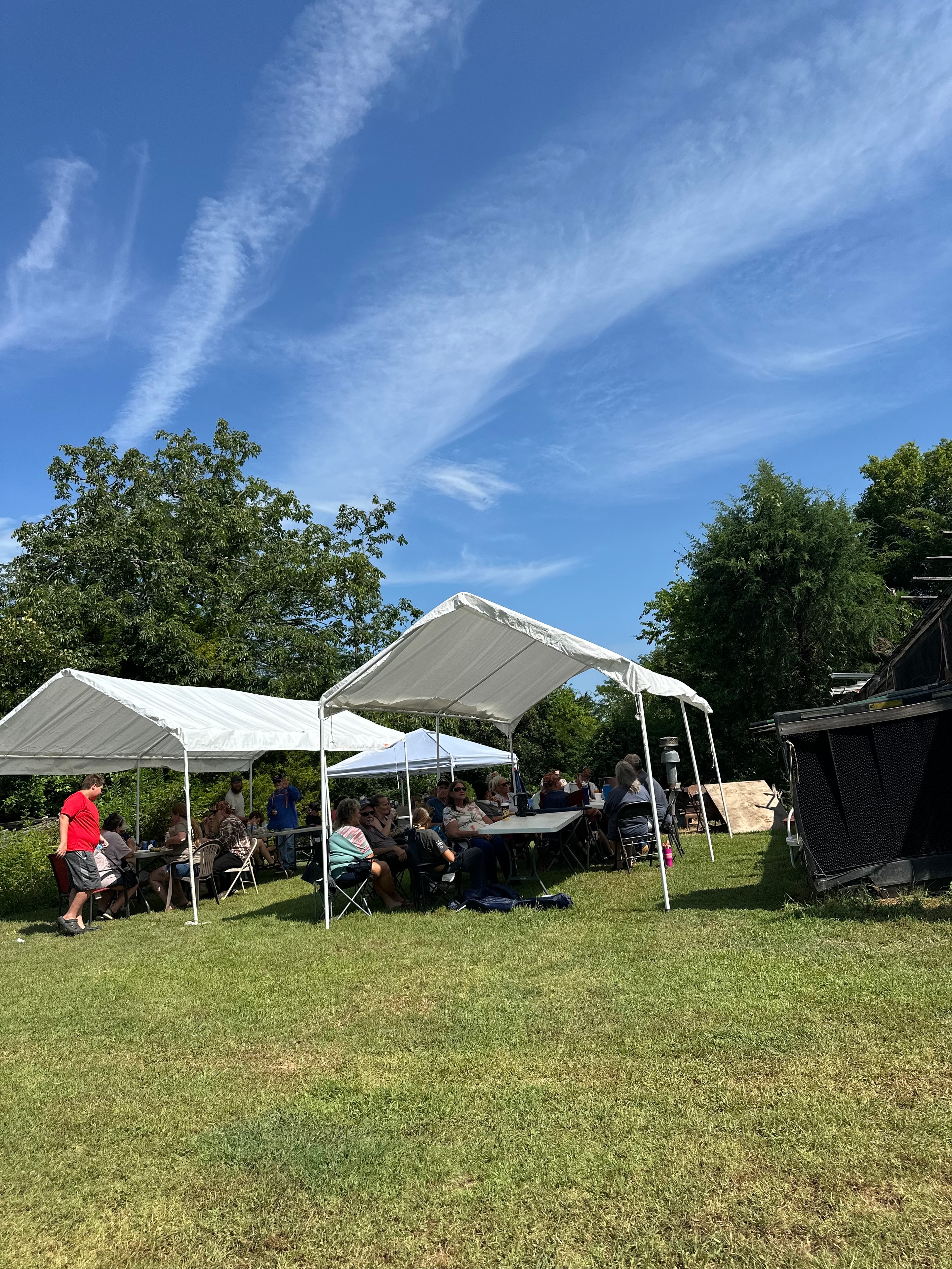 Tribal members gathered under the tent at the ceremonial grounds at Green Tree Ceremony July 11, 2026