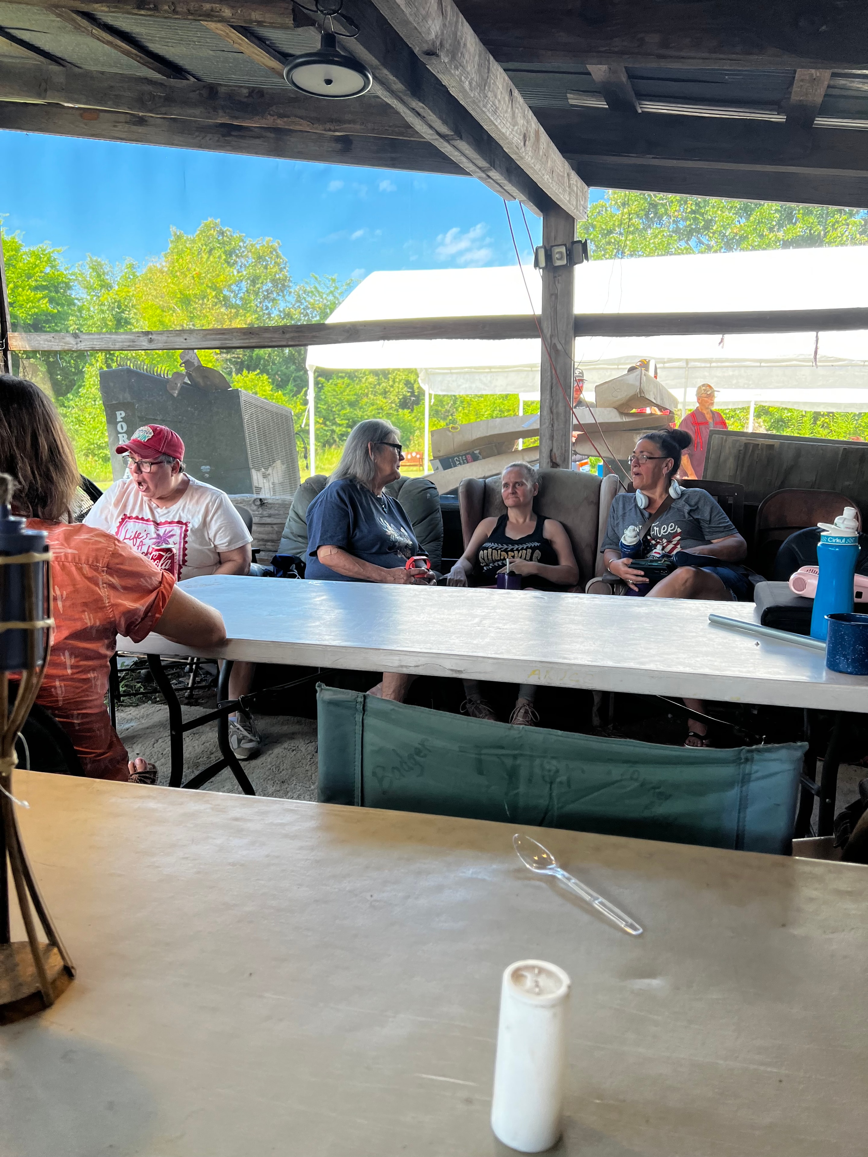 Tribal members gathered at tables inside the pavilion at Green Tree Ceremony July 11, 2026