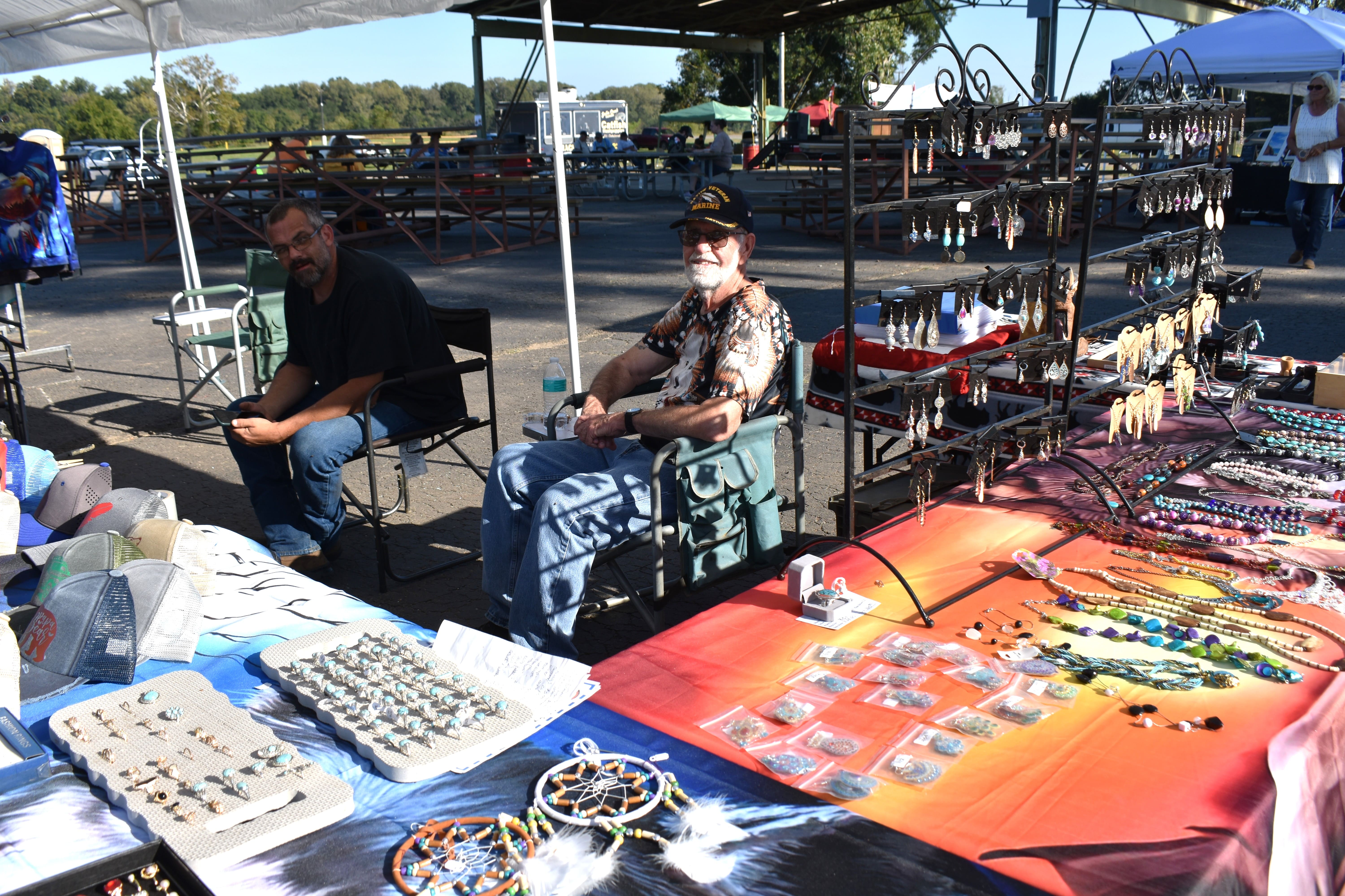 Two vendors at a Native jewelry and dreamcatcher booth at October Festival 2025