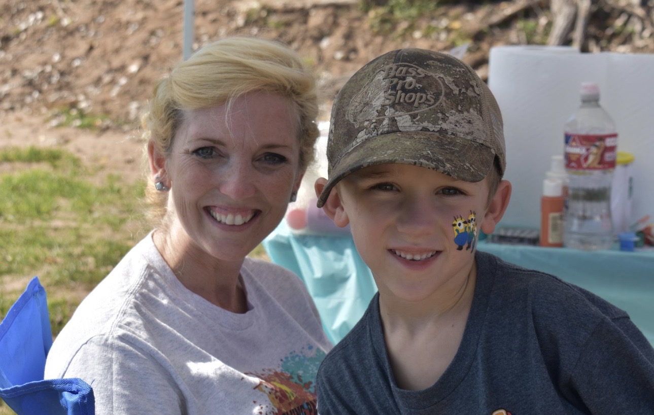 Mother and son with face paint at Cherokee Chickamauga community event