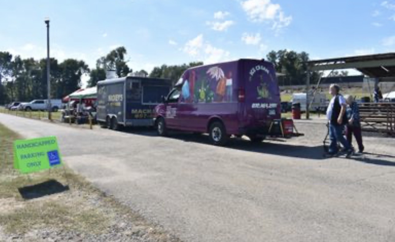 Aerial view of vendor tents, bounce house and parking at Cherokee Chickamauga community event