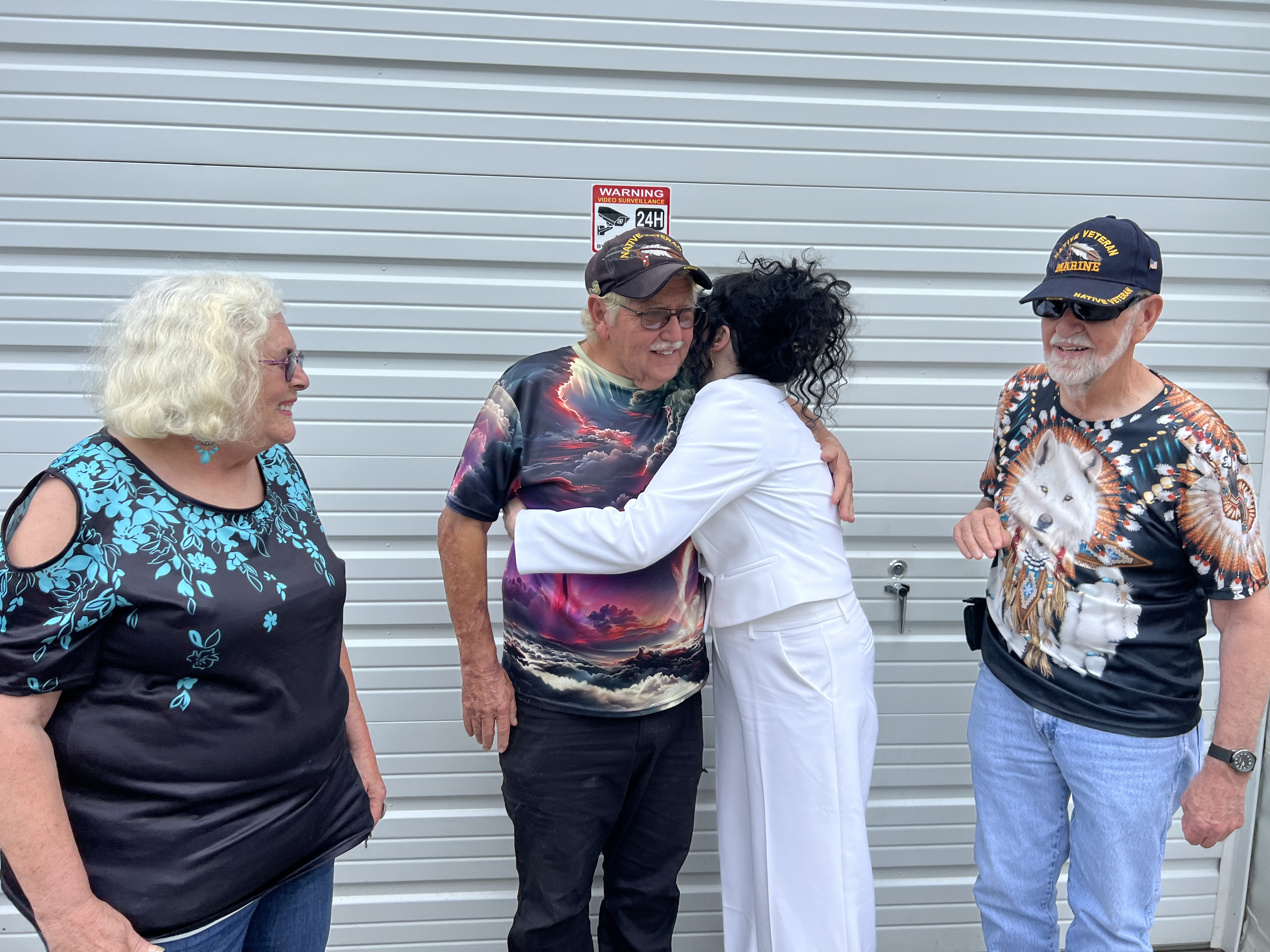 Tribal members embracing at community gathering — Sovereign Chickamauga Cherokee Tribe of Arkansas