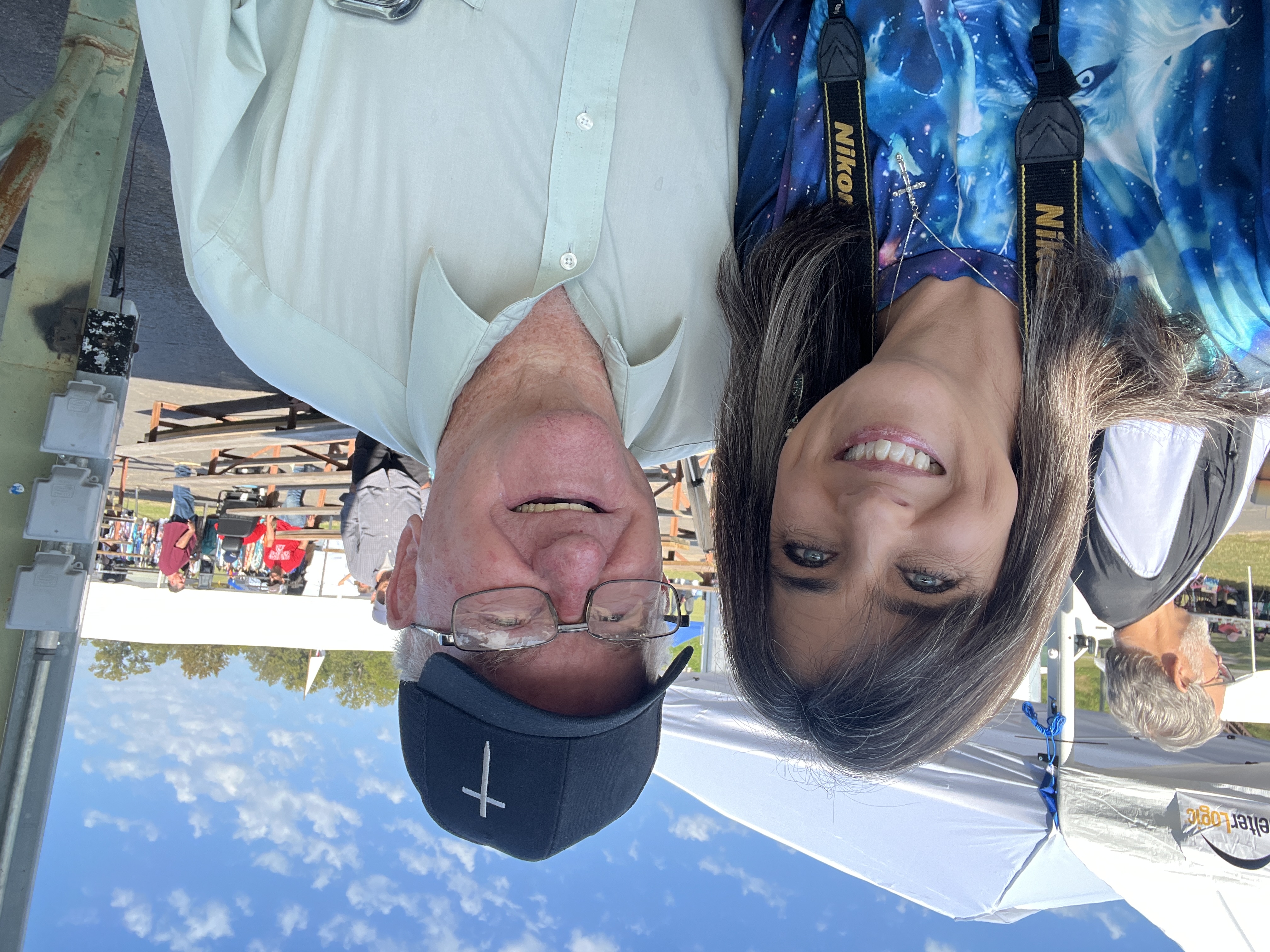 Two community members smiling at October Festival 2025