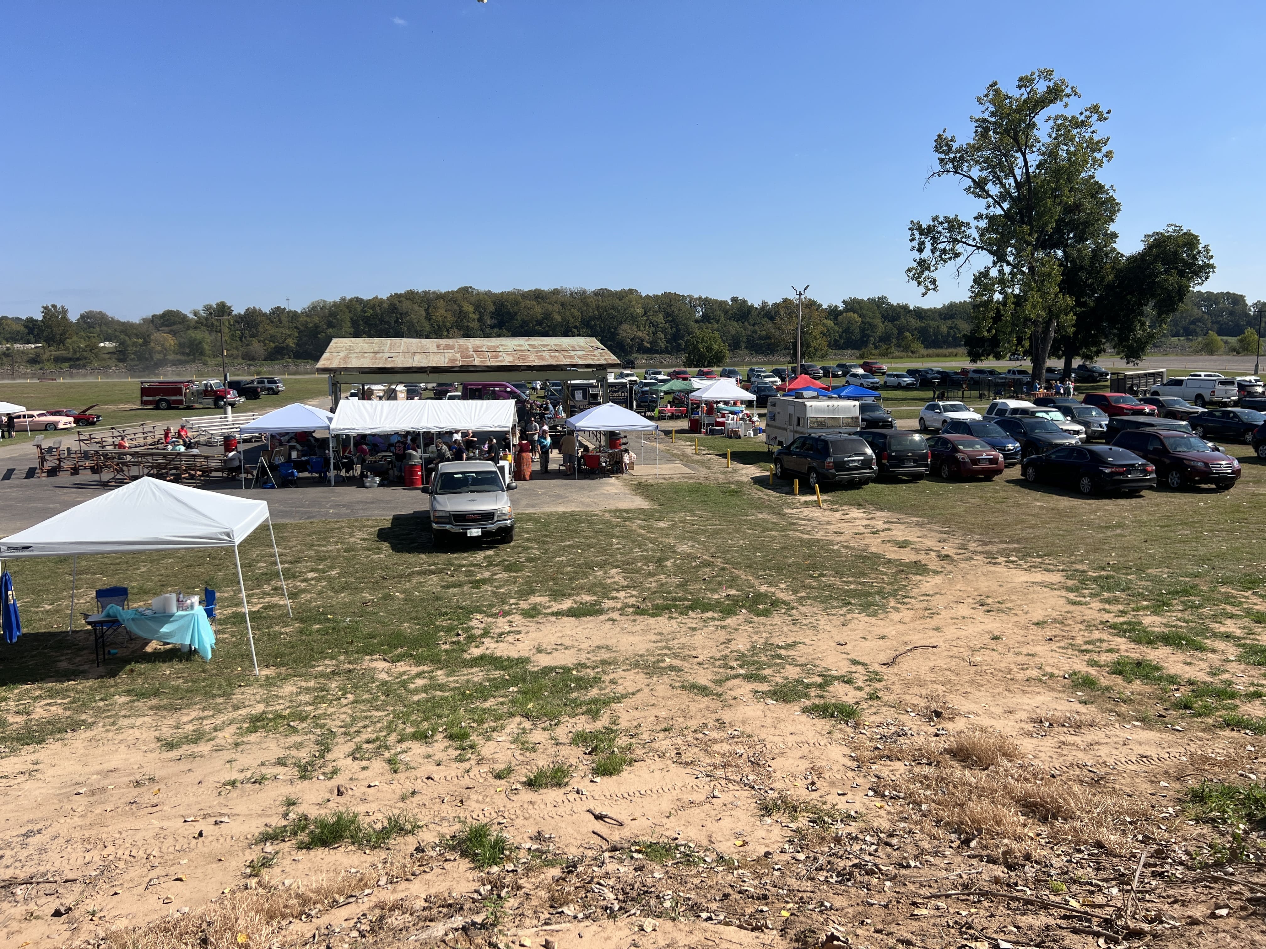 Wide view of vendor tents and packed parking lot at October Festival 2025