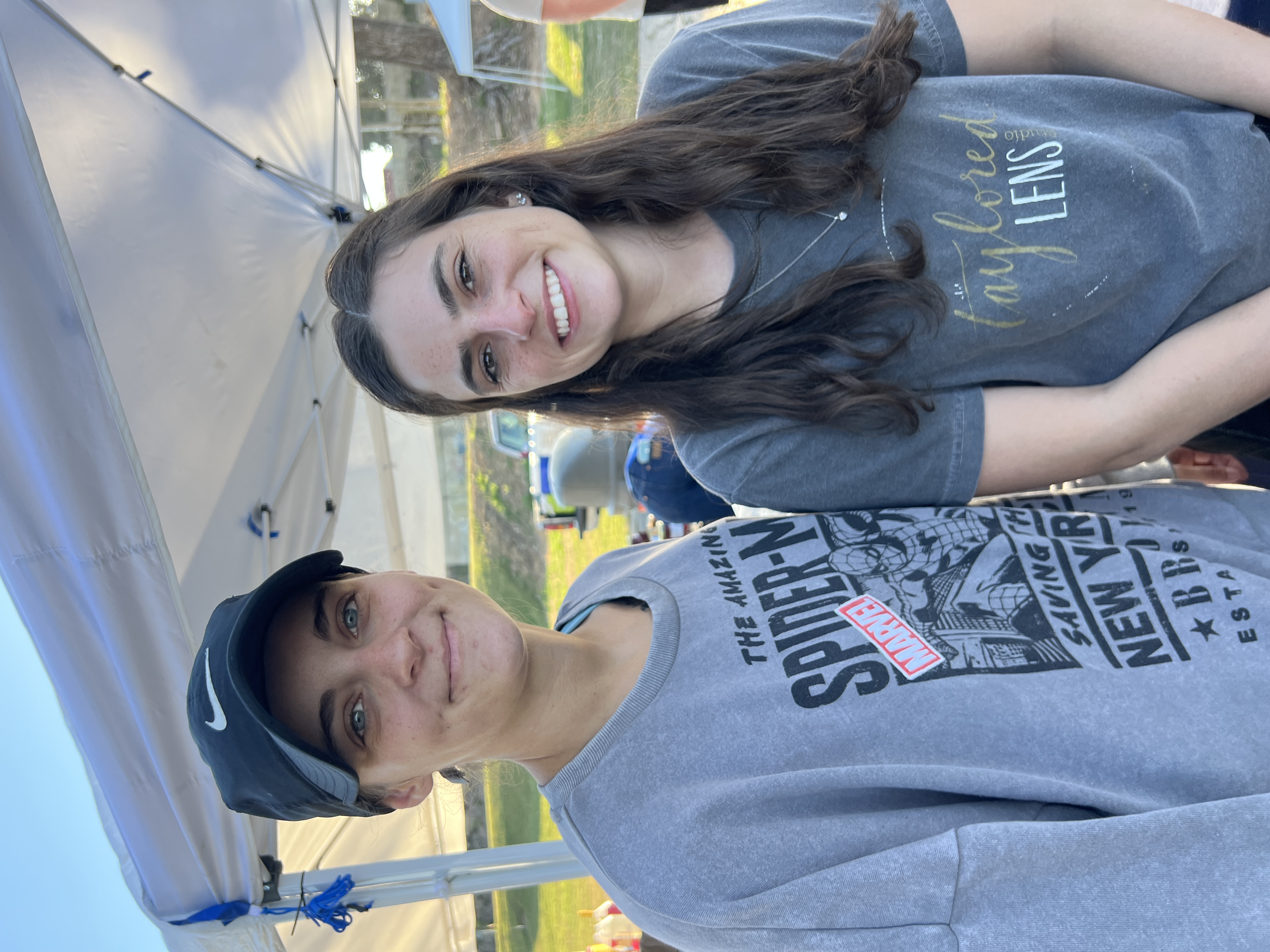 Two young community members smiling at October Festival 2025